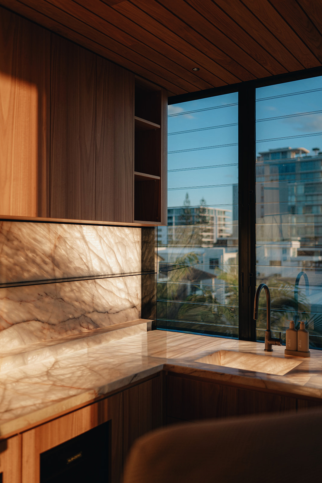 Marble and timber luxury kitchen with ocean views
