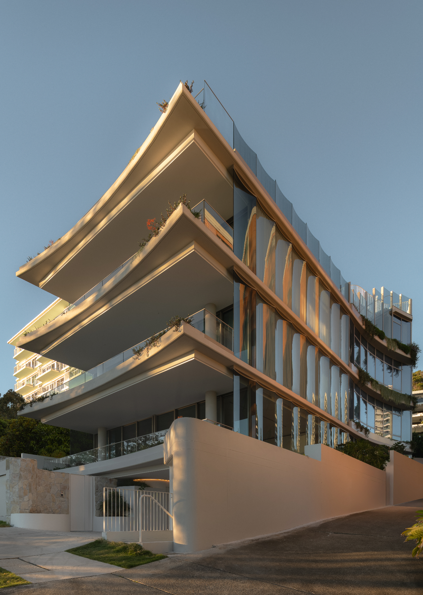 Award-winning coastal apartment building at dusk